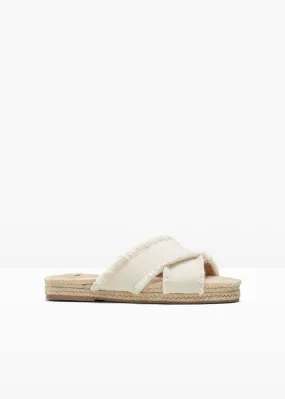 Beige natural mules.