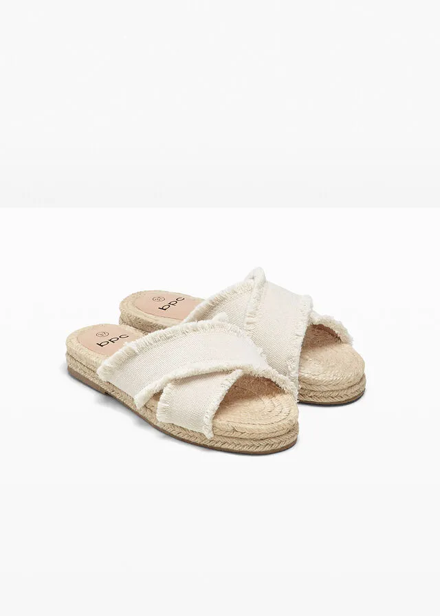 Beige natural mules.