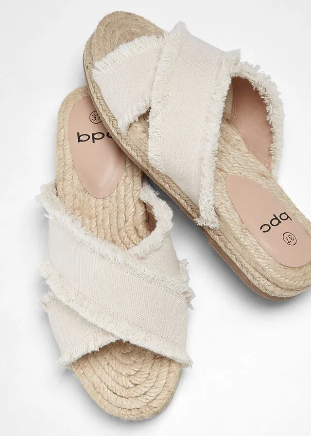 Beige natural mules.