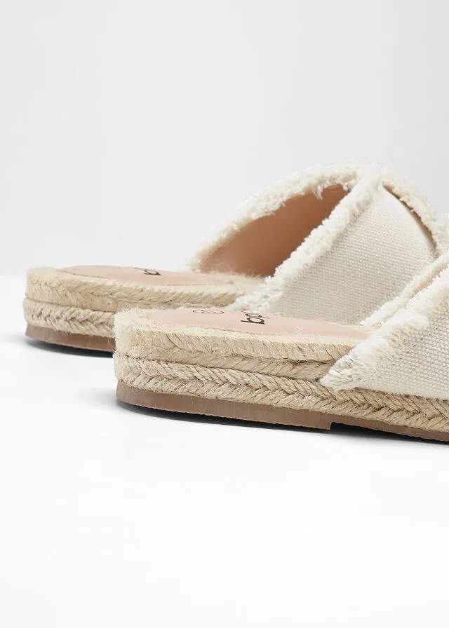 Beige natural mules.