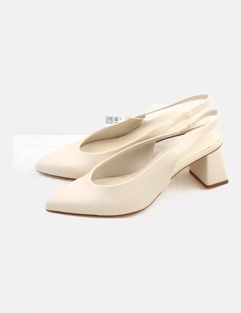 Beige Stradivarius mules with high heels.