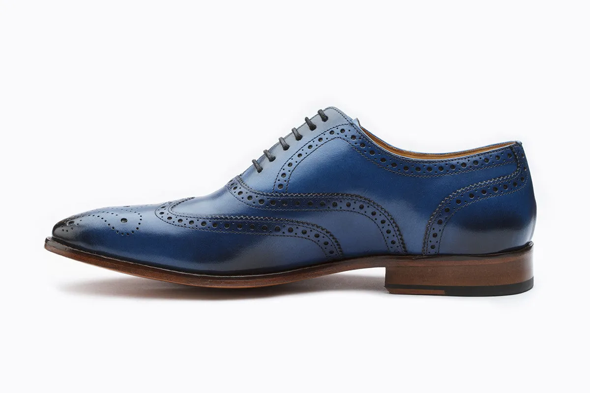 Blue wingtip brogue Oxford shoe with medallion