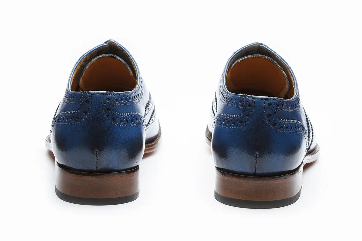 Blue wingtip brogue Oxford shoe with medallion