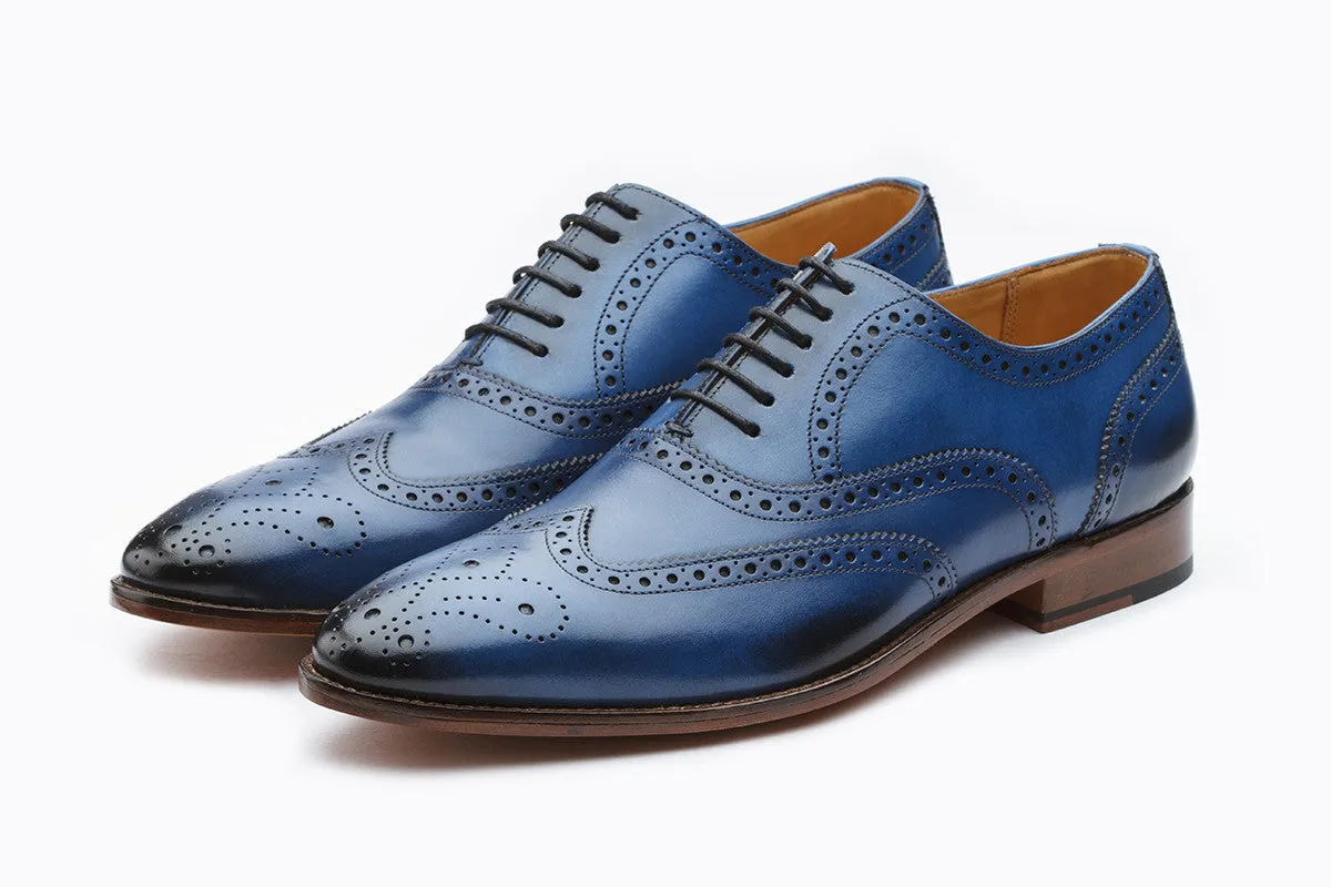 Blue wingtip brogue Oxford shoe with medallion