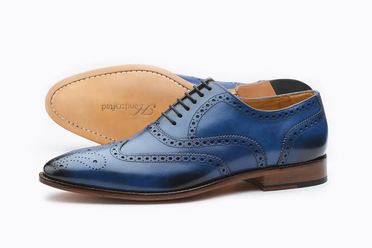 Blue wingtip brogue Oxford shoe with medallion