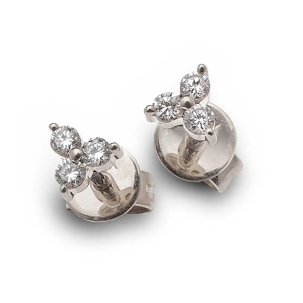 Diamond stud earrings trio.